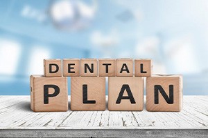 Blocks spell out “dental plan”