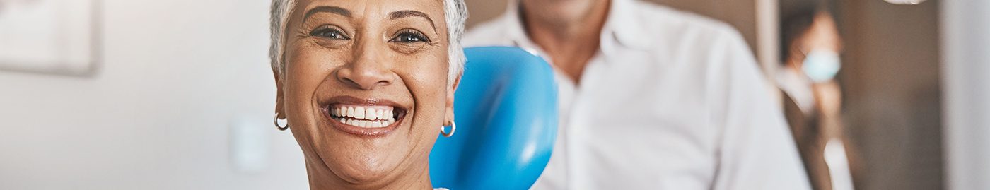 Woman with dentures in Albuquerque